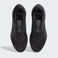 Top-down view of a pair of Nike Quest 5 Men's running trainers in black, highlighting their streamlined silhouette and lace-up closure.