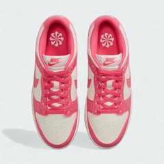 Top-down view of a pair of Nike Dunk Low Next Nature Women's trainers in pink, highlighting the lace-up closure and perforated toe box.