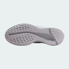 View of the outsole of the Nike Quest 5 Women's white running shoes, showing the durable rubber tread pattern for road traction.