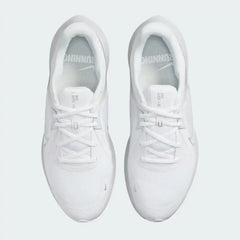 Top-down view of a pair of Nike Quest 5 Women's running shoes in white, highlighting their streamlined silhouette and lace-up closure.