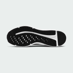 View of the outsole of the Nike Downshifter 12 Men's black training shoes, showing the durable rubber tread pattern for multi-surface traction.