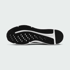 View of the outsole of the Nike Downshifter 12 Men's black training shoes, showing the durable rubber tread pattern for multi-surface traction.