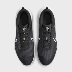 Top-down view of a pair of Nike Downshifter 12 Men's training shoes in black, highlighting their streamlined silhouette and lace-up closure.
