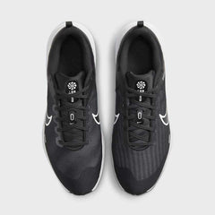 Top-down view of a pair of Nike Downshifter 12 Men's training shoes in black, highlighting their streamlined silhouette and lace-up closure.
