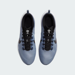 Top-down view of a pair of Nike Downshifter 12 Men's training shoes in grey, highlighting their streamlined silhouette and lace-up closure.