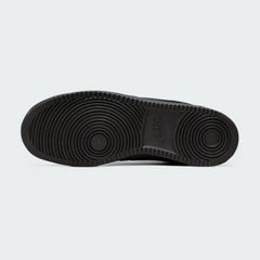 View of the outsole of the Nike Court Vision Lo Next Nature Men's black trainers, showing the durable rubber sole and pivot circle traction pattern.