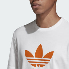 Close-up zoom on the Adidas Trefoil T-Shirt Men's in white, showing the soft cotton jersey fabric texture and the clear orange Trefoil logo print.