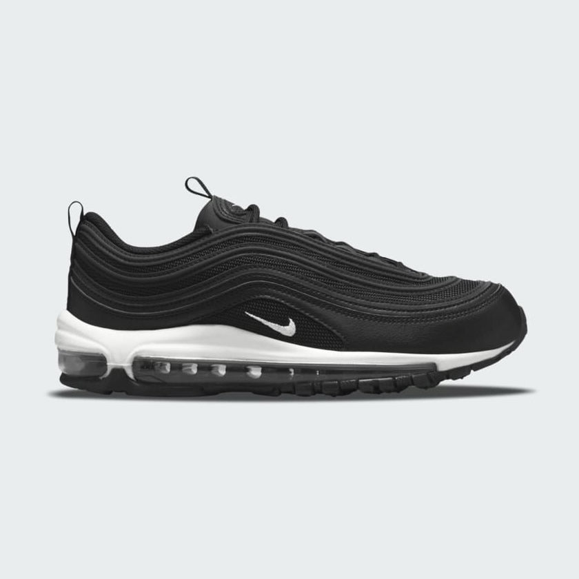 Nike Air Max 97 Women's trainers in black, side profile showing a full-length visible Max Air unit and iconic wavy upper design.