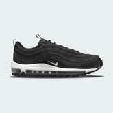 Nike Air Max 97 Women's trainers in black, side profile showing a full-length visible Max Air unit and iconic wavy upper design.