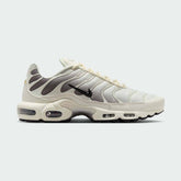 Nike Air Max Plus TN Men's trainers in light orewood brown beige, side profile showing visible Tuned Air units and distinctive wavy overlays.