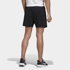 adidas Essentials Men's Chelsea Shorts DQ3085 worn in a standing pose showing athletic fit