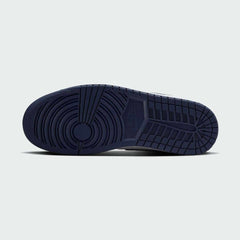 View of the outsole of the Air Jordan 1 Mid Men's white trainers, showing the durable rubber sole and classic traction pattern.