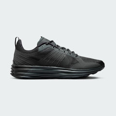 Nike Lunar Roam Men's trainers in dark smoke grey and black, side profile showing plush Lunar foam midsole and breathable textile upper.