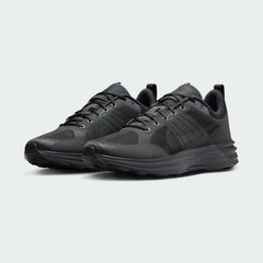 Angled view of two Nike Lunar Roam Men's trainers in dark smoke grey and black, side by side, showcasing their sleek design and chunky sole.