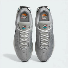 Top-down view of a pair of Nike Air Max DN Men's running shoes in grey, highlighting their futuristic design and lace-up closure.