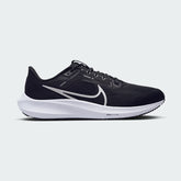 Nike Air Zoom Pegasus 40 Men's running trainers in black with white accents, side profile showing engineered mesh upper, prominent Nike Swoosh, and cushioned midsole.