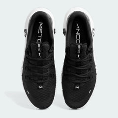 Top-down view of a pair of Nike Free Metcon 5 Men's training shoes in black, highlighting their athletic silhouette and lace-up closure.