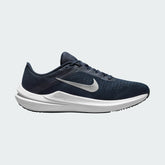 Nike Air Winflo 10 Men's running shoes in midnight navy with white accents, side profile showing engineered mesh upper, prominent Nike Swoosh, and cushioned Air midsole.