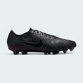 Nike Legend 10 Elite FG men's football boots in black with a deep jungle green Swoosh, side profile showing the FlyTouch Plus upper and firm ground studs.