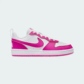 Nike Court Borough Low Recraft Juniors' trainers in white with laser fuchsia pink accents, side profile showing synthetic leather upper and a pink Nike Swoosh.