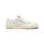 Side profile of a cream-coloured Reebok Club C sneaker with a green and red logo window on the side.