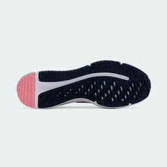 View of the outsole of the Nike Downshifter 12 Premium Women's white training shoes, showing the durable rubber tread pattern for multi-surface traction.