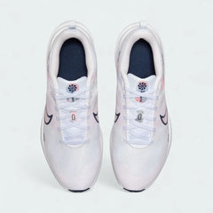 Top-down view of a pair of Nike Downshifter 12 Premium Women's training shoes in white, highlighting their streamlined silhouette and lace-up closure.