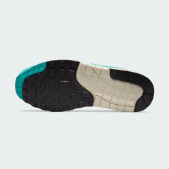 View of the outsole of the Nike Air Max 1 Women's trainers, showing the durable rubber waffle tread pattern.