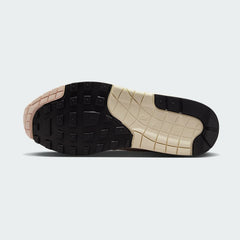 View of the outsole of the Nike Air Max 1 Women's trainers, showing the durable rubber waffle tread pattern.