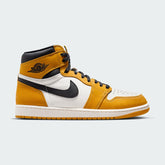 Air Jordan 1 Retro High OG Men's trainers in yellow ochre and black, side profile showing leather upper, high-top design, and black Nike Swoosh.