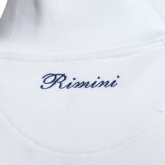 Close-up zoom on the fabric of the Ellesse Rimini Track Jacket in white, showing the smooth tricot texture and the embroidered Ellesse logo on the chest.