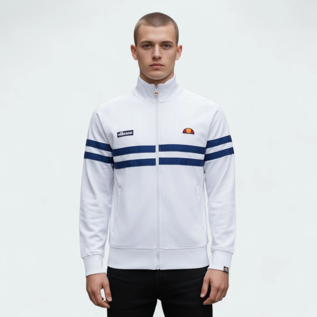 Ellesse Rimini Track Jacket Men's in white, front view shown a male model showing the full zip, stand-up collar, and iconic blue and red stripes across the chest and sleeves.