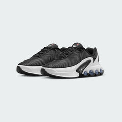 Nike Air Max DN Juniors Casual Trainers FB8987-003 angled view showing layered textures and sculpted midsole