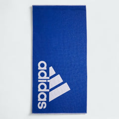 Fully unfolded Adidas Cotton Towel in royal blue, displaying its entire 70 cm x 140 cm surface and soft texture.