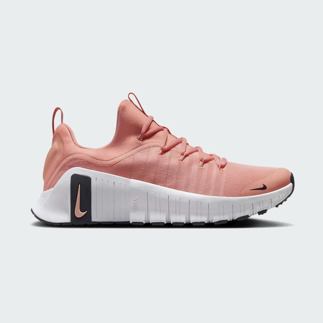 Nike Free Metcon 5 Men's training shoes in apricot agate orange with black and white accents, side profile showing mesh upper, flexible forefoot, and stable heel.