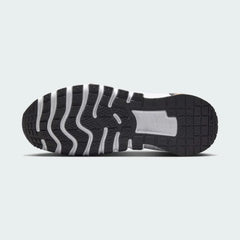 View of the outsole of the Nike Free Metcon 5 Men's orange training shoes, showing the multi-directional traction pattern for versatile gym performance.