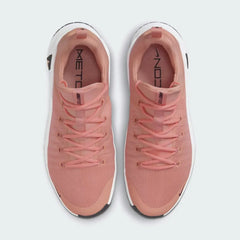 Top-down view of a pair of Nike Free Metcon 5 Men's training shoes in orange, highlighting their athletic silhouette and lace-up closure.