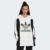 Adidas Women's Oversized Bellista Hoodie in white, front view showing large hood, long sleeves, ribbed cuffs and hem, and small Adidas Trefoil logo.