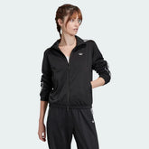 Adidas Women's Archival Track Jacket in black, front view showing full zip, stand-up collar, white 3-Stripes on sleeves, and embroidered Trefoil logo.