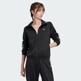 Adidas Women's Archival Track Jacket in black, front view showing full zip, stand-up collar, white 3-Stripes on sleeves, and embroidered Trefoil logo.