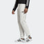 Highlights the tapered leg and the signature stacked logo badge.