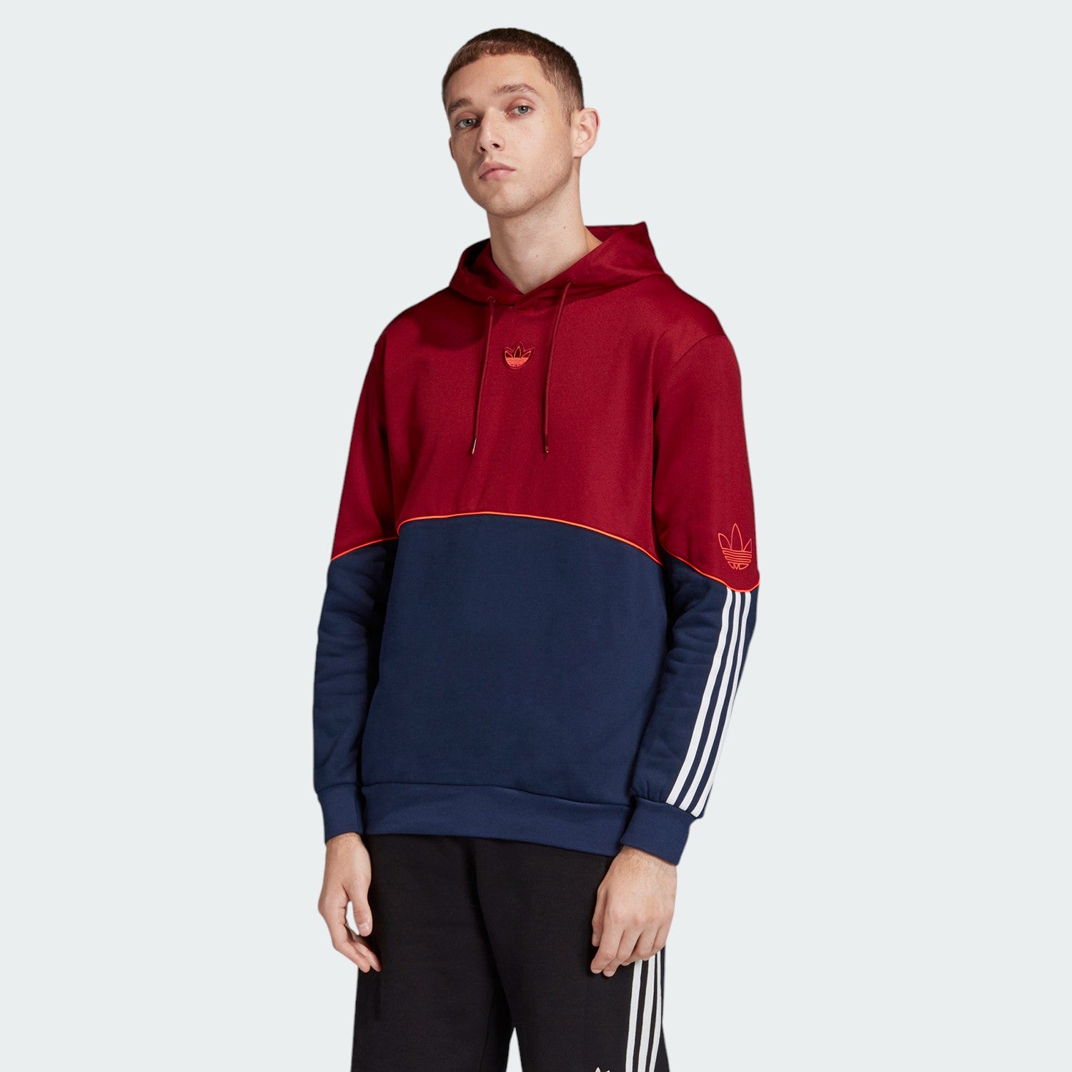 Adidas Outline Overhead Hoodie Men's in active red, front view showing large white Trefoil outline logo on the chest and a kangaroo pocket.