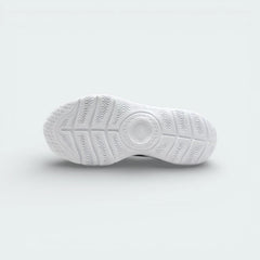 View of the white foam outsole, showing the deep flex grooves designed for natural movement.