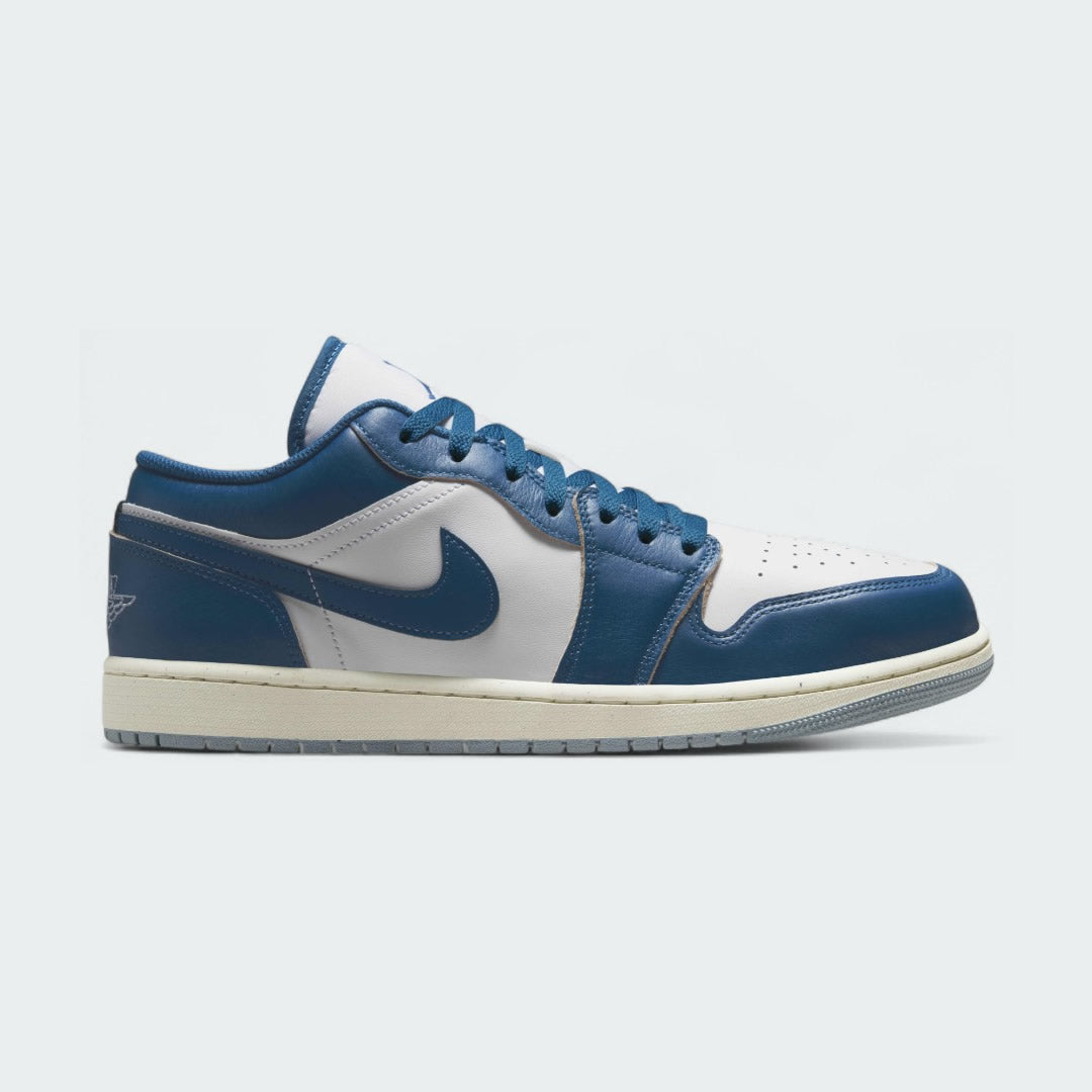 Air Jordan 1 Low Special Edition Men's trainers in white with blue accents, side profile showing classic leather upper, perforated toe box, and Nike Swoosh.