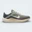 Side profile of the Nike Air Winflo 10 in Flat Pewter, showing the large white Swoosh, breathable engineered mesh, and the thick cushioned midsole.
