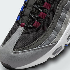 Close-up zoom on the front of the Nike Air Max 95 Next Nature Men's trainers, showing the intricate lacing system, mesh tongue, and layered overlays.
