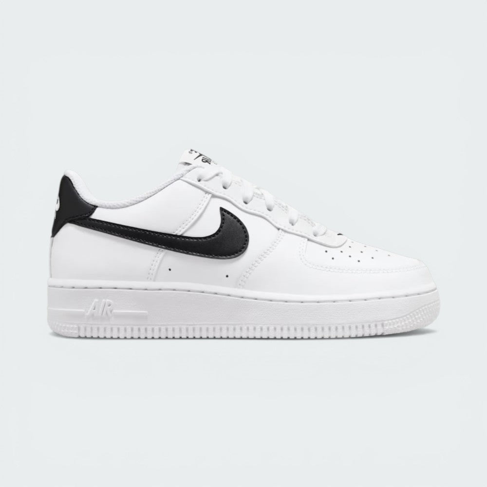 Side profile of the White/Black Nike Air Force 1 Junior, showcasing the bold black Swoosh against the crisp white leather.