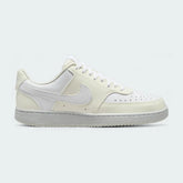Nike Court Vision Lo Next Nature Women's trainers in white with a white Nike Swoosh, side profile showing classic basketball-inspired design and low-cut collar.