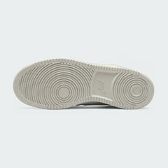 View of the outsole of the Nike Court Vision Lo Next Nature Women's white trainers, showing the durable rubber sole and pivot circle traction pattern.