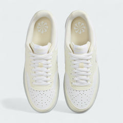 Top-Down view of a pair of Nike Court Vision Lo Next Nature Women's trainers in white, highlighting the lace-up closure and perforated toe box.